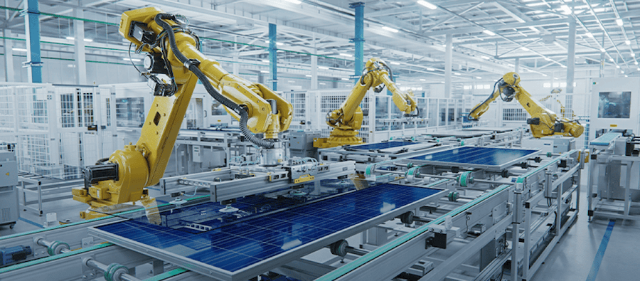 Imagen que muestra una serie de brazos robóticos colaborando en un entorno de producción.